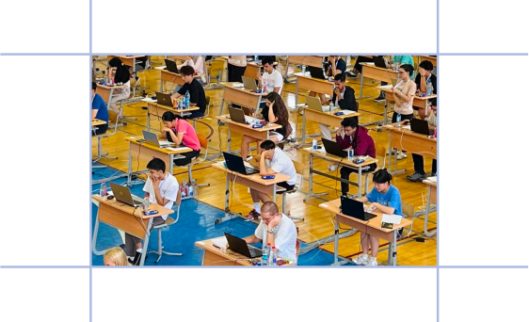 Students competing in an Economics Olympiad round in an exam hall